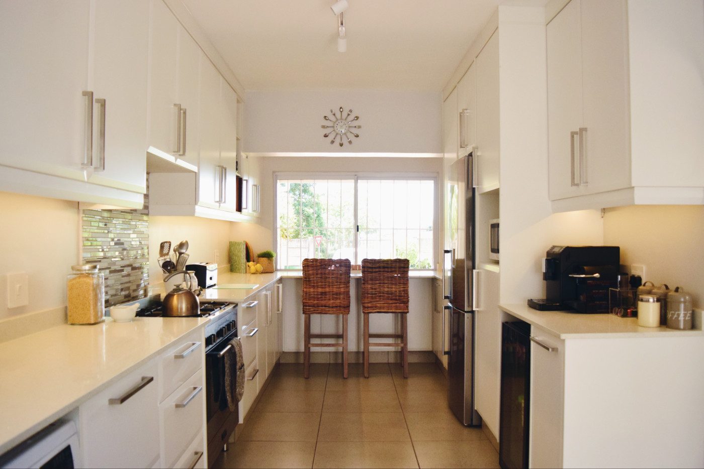 Clean and light kitchen design helps to create a feeling of open space.